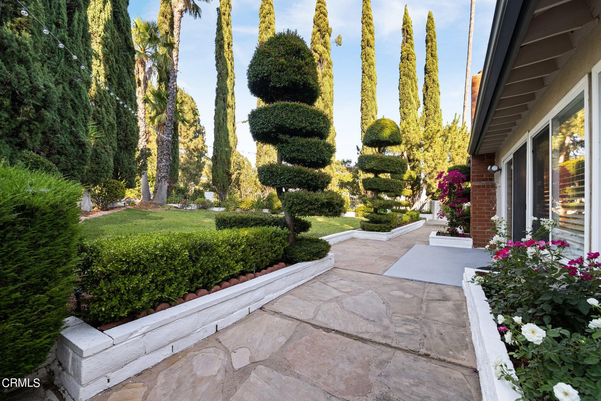 9356 Skyview Terrace Tujunga, CA 91042 - Photo 31 of 39 a view of a garden with flowers and trees