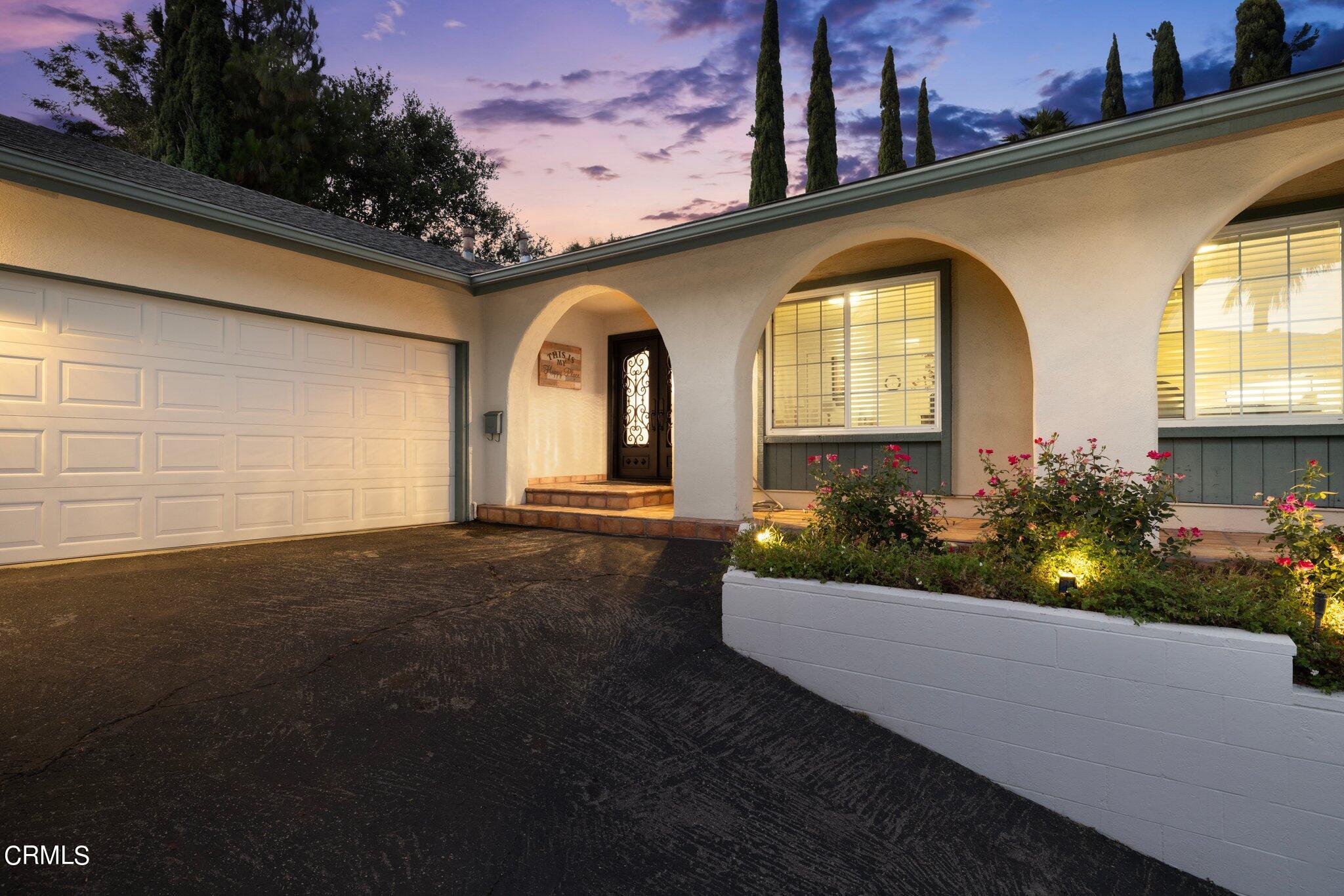 9356 Skyview Terrace Tujunga, CA 91042 - Photo 4 of 39 a front view of a house with a garden