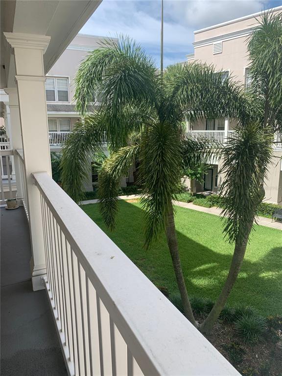 571 Water Street, Unit 571 Celebration, FL 34747 - Photo 22 of 26 a view of a garden from a balcony