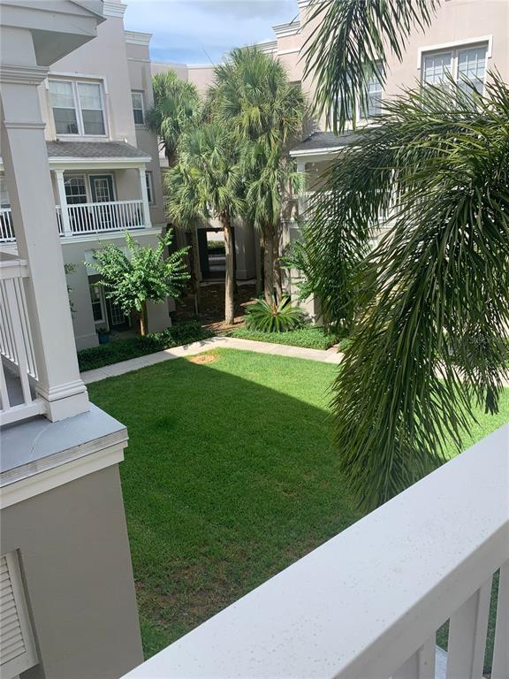 571 Water Street, Unit 571 Celebration, FL 34747 - Photo 23 of 26 a view of a house with a yard