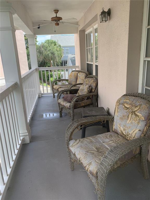 571 Water Street, Unit 571 Celebration, FL 34747 - Photo 25 of 26 a living room with furniture and a fireplace