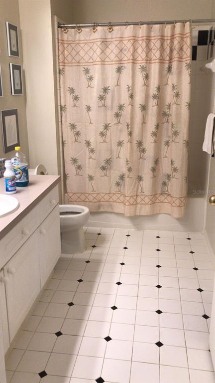 571 Water Street, Unit 571 Celebration, FL 34747 - Photo 7 of 26 a bathroom with a sink toilet and shower