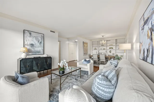 a living room with furniture or couch and a wooden floor