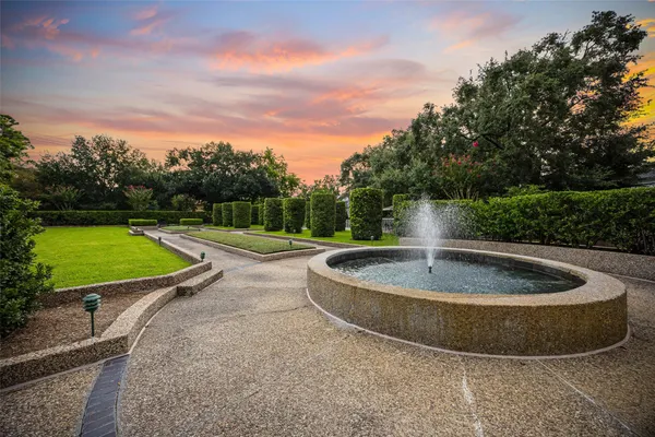 a view of a swimming pool and a yard