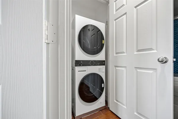 a view of a hallway with washer and dryer