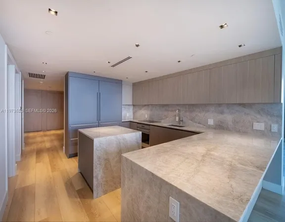 a view of a livingroom with wooden floor
