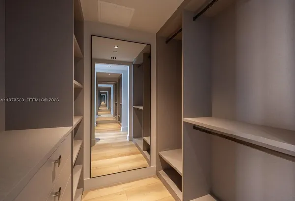 a room with table chairs and a chandelier