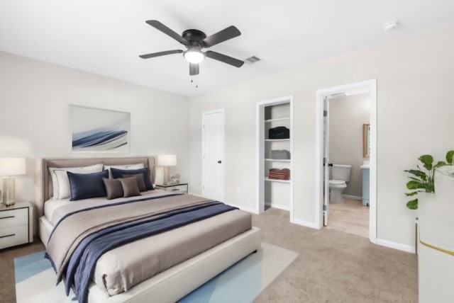 3106 Michigan Street Baytown, TX 77520 - Photo 12 of 14 a bedroom with a large bed and a chandelier