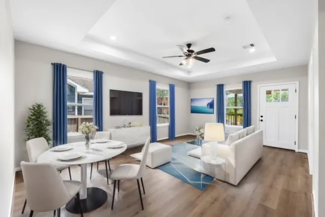 a living room with furniture fireplace and a flat screen tv