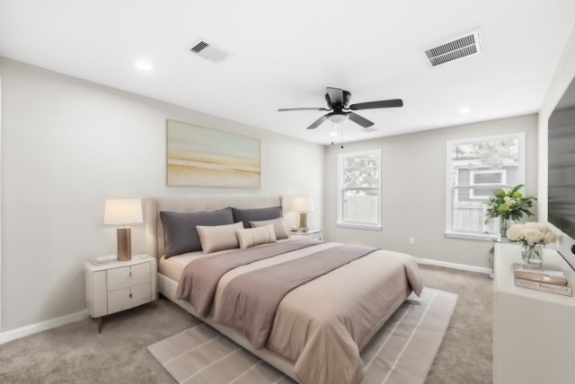 3106 Michigan Street Baytown, TX 77520 - Photo 9 of 14 a bedroom with a bed and a chandelier