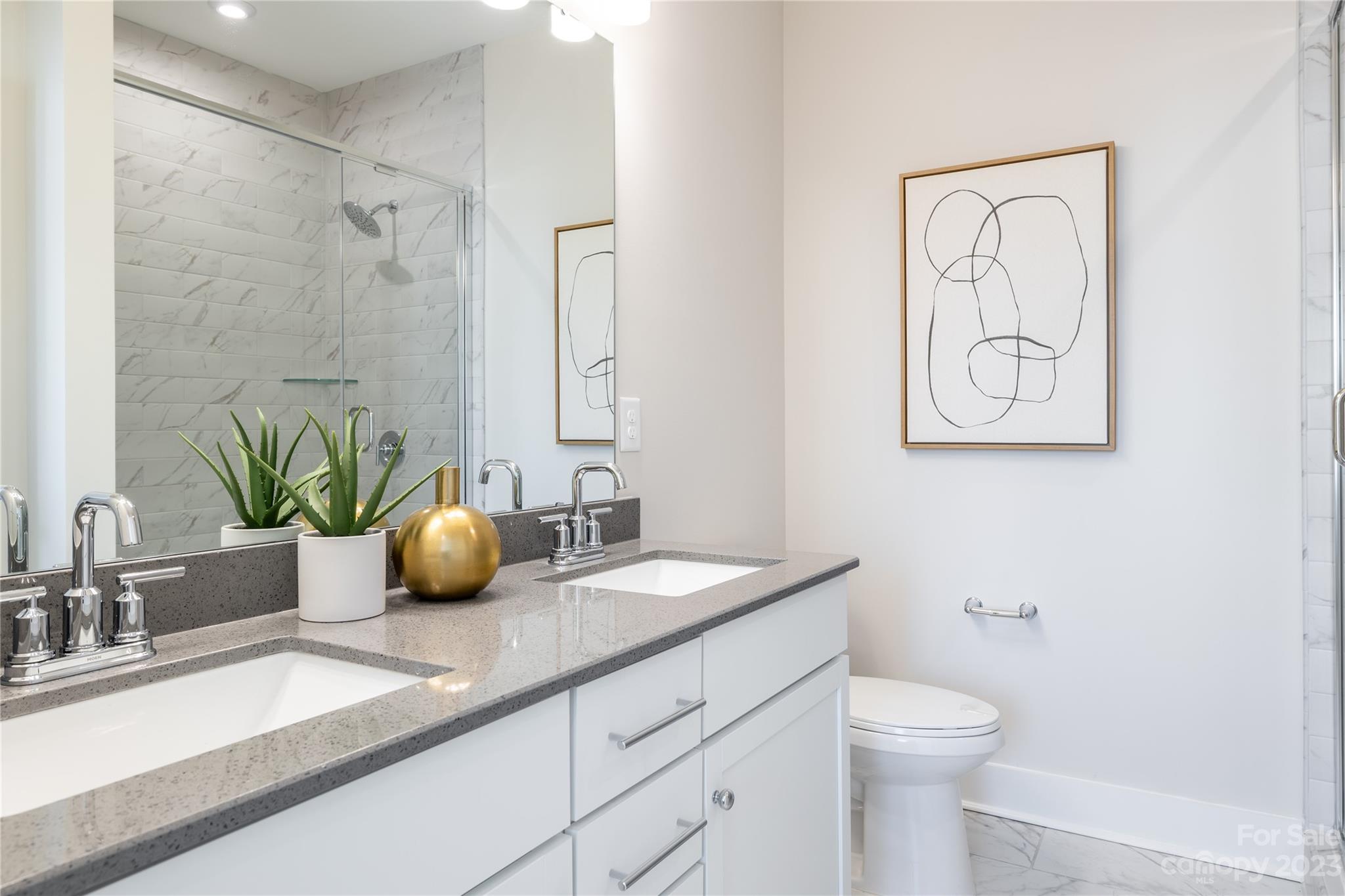 4020 Capital Ridge, Unit 23 Charlotte, NC 28205 - Photo 6 of 8 a bathroom with a granite countertop sink a toilet and mirror