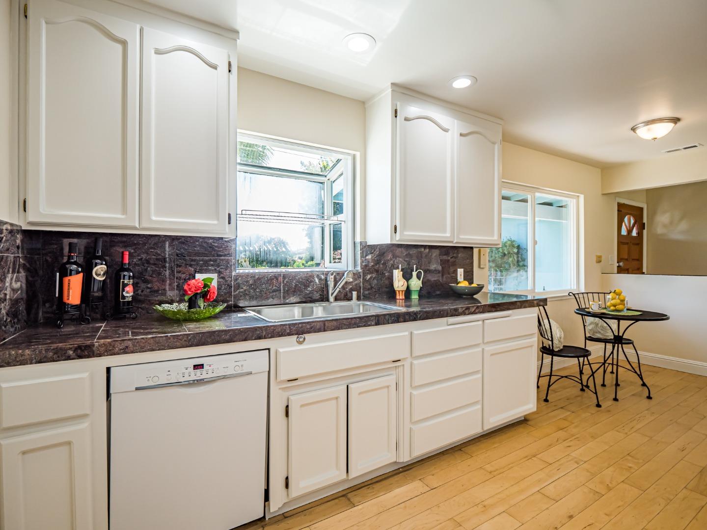 237 Siesta Drive Aptos, CA 95003 - Photo 14 of 43 a kitchen with stainless steel appliances granite countertop a sink and cabinets