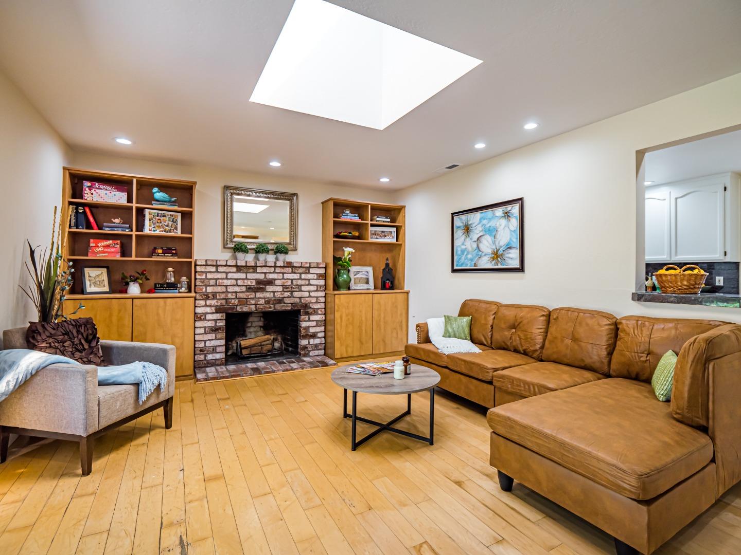 237 Siesta Drive Aptos, CA 95003 - Photo 19 of 43 a living room with fireplace furniture and a large window