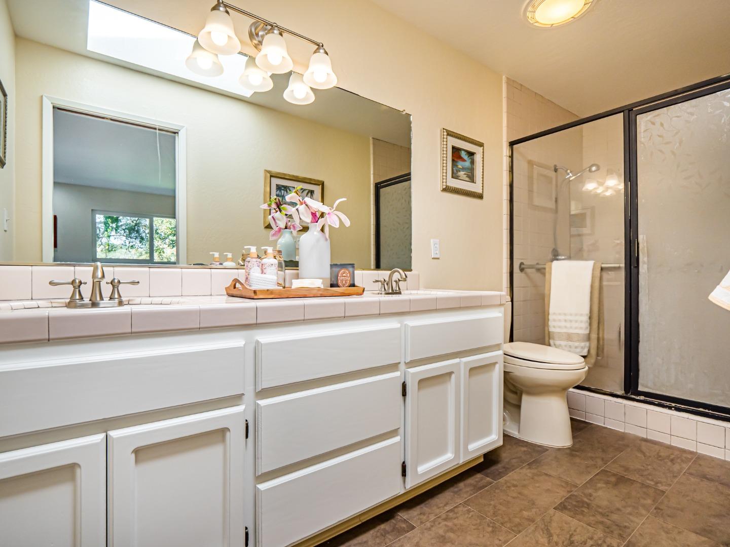 237 Siesta Drive Aptos, CA 95003 - Photo 23 of 43 a bathroom with a toilet a sink and a mirror
