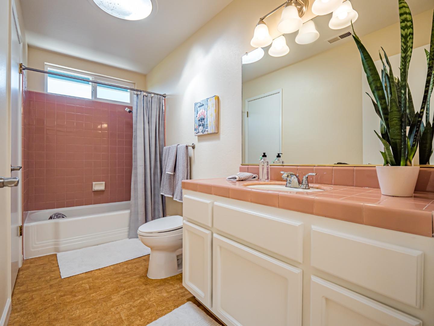 237 Siesta Drive Aptos, CA 95003 - Photo 27 of 43 a bathroom with a sink a toilet and a mirror