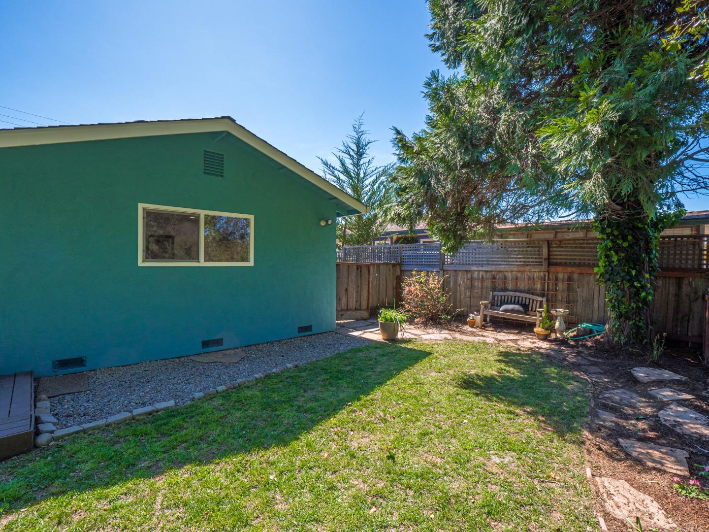 237 Siesta Drive Aptos, CA 95003 - Photo 33 of 43 a view of a backyard with table and chairs and a barbeque