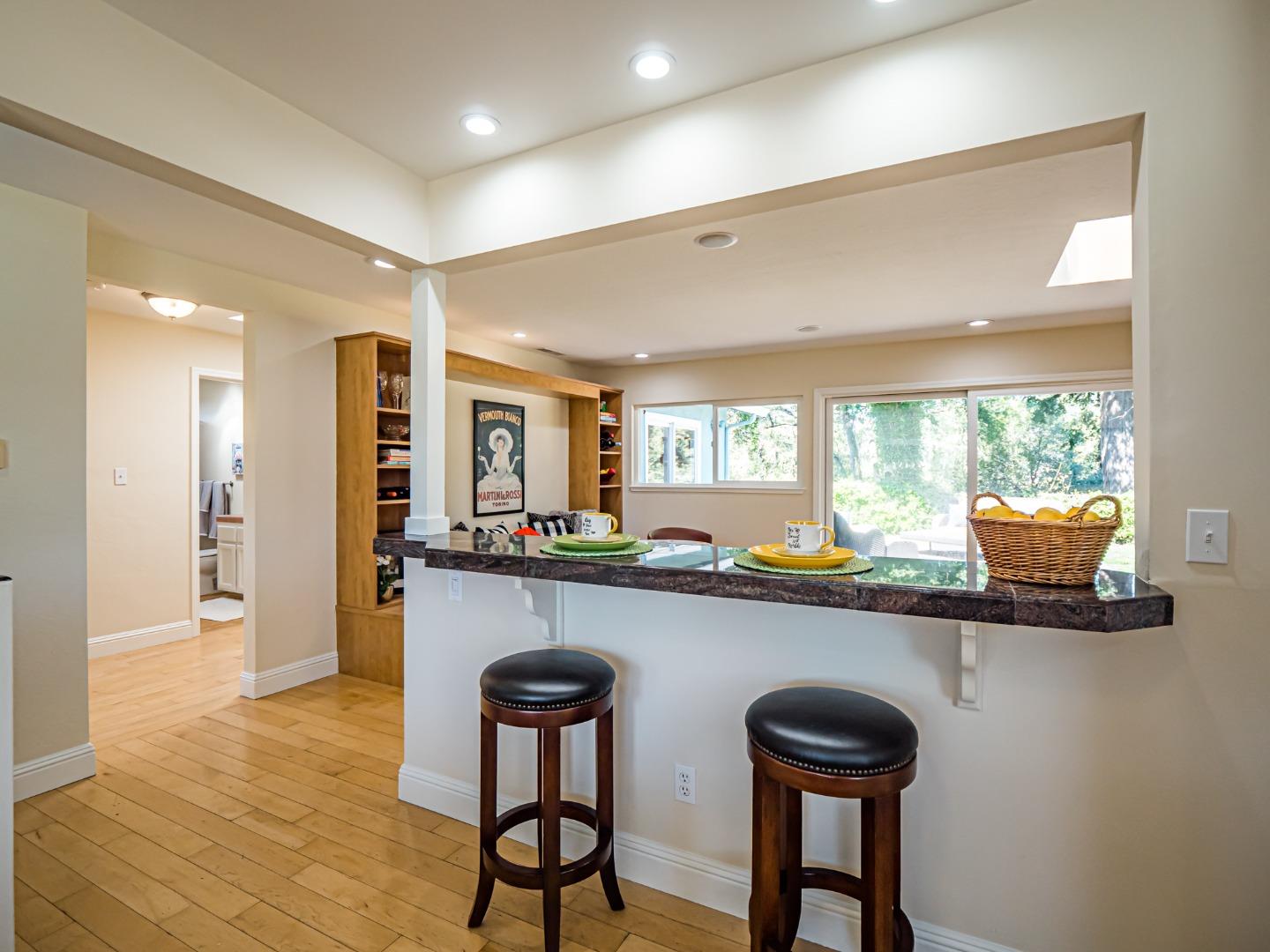 237 Siesta Drive Aptos, CA 95003 - Photo 10 of 43 a kitchen with a sink a counter space dining table and chairs