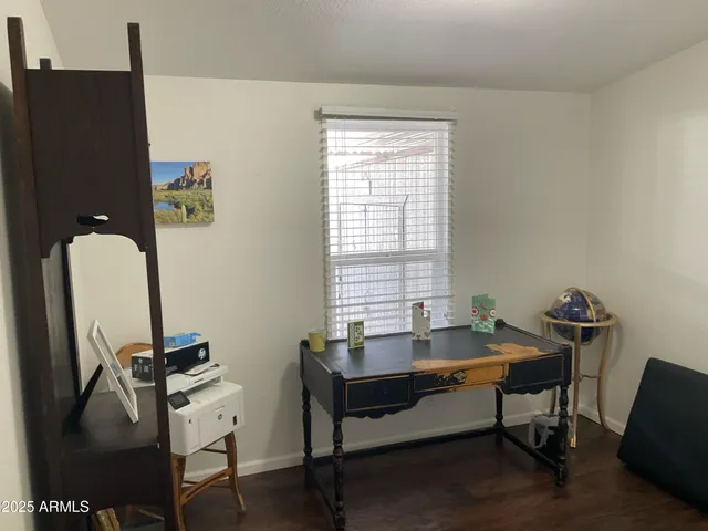 a reading room with furniture and a window