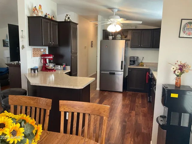 a kitchen with refrigerator and sink
