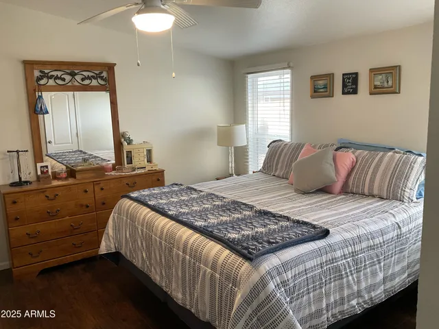 a bedroom with a bed and a dresser