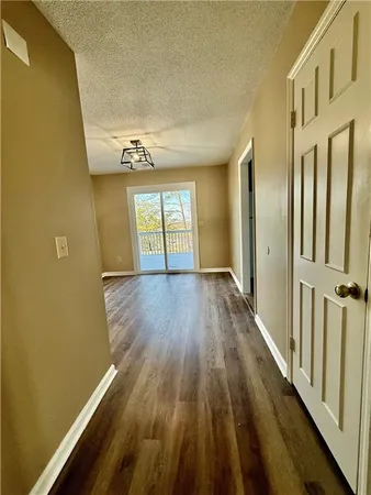 a view of gallery with wooden floor