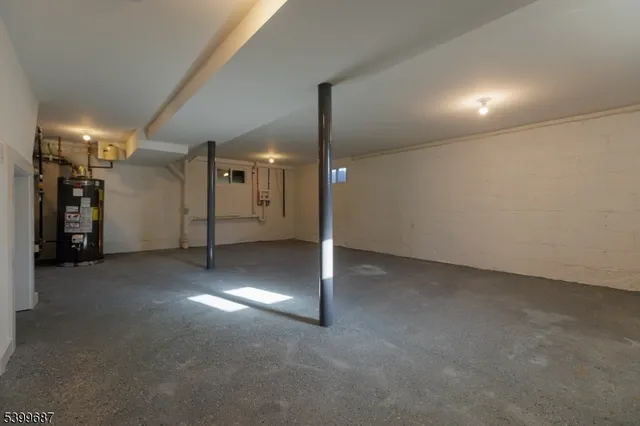 a view of a big room with staircase and a projector