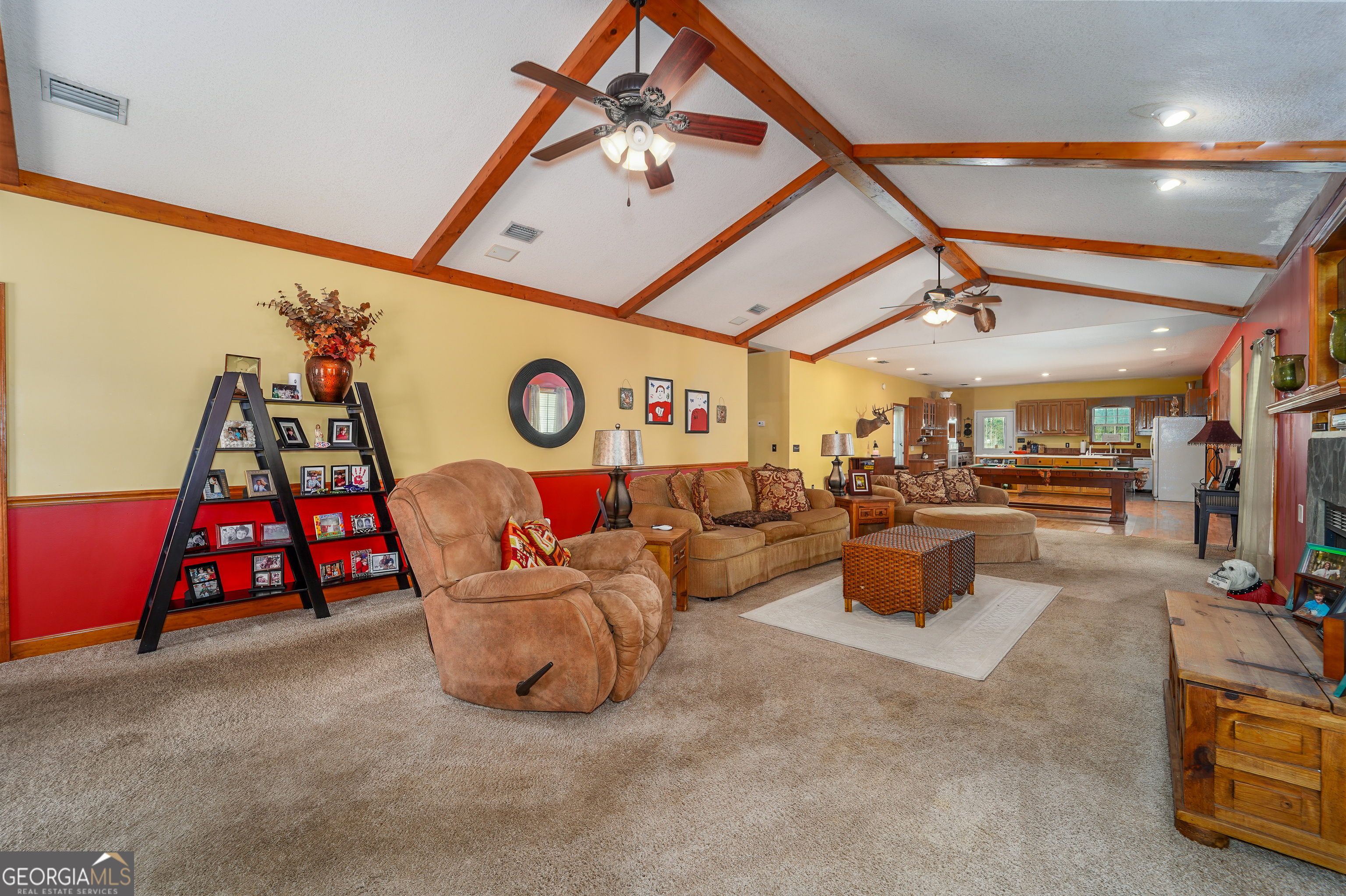 3300 Connor Lane Waycross, GA 31503 - Photo 18 of 42 a living room with lots of furniture and a flat screen tv