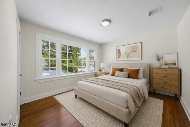 a bathroom with a toilet sink and vanity
