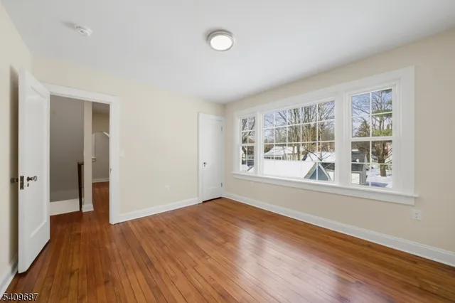 a bathroom with a sink mirror and toilet