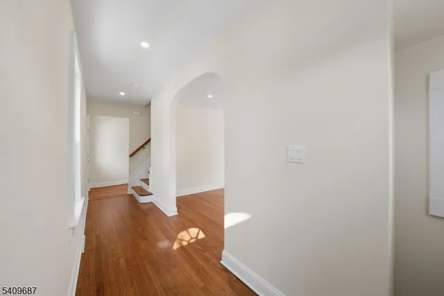 a living room with furniture potted plant and a fireplace