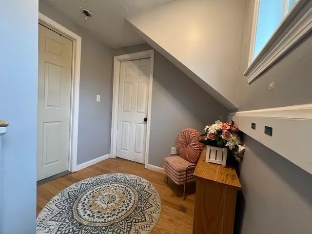 a living room with furniture and a rug