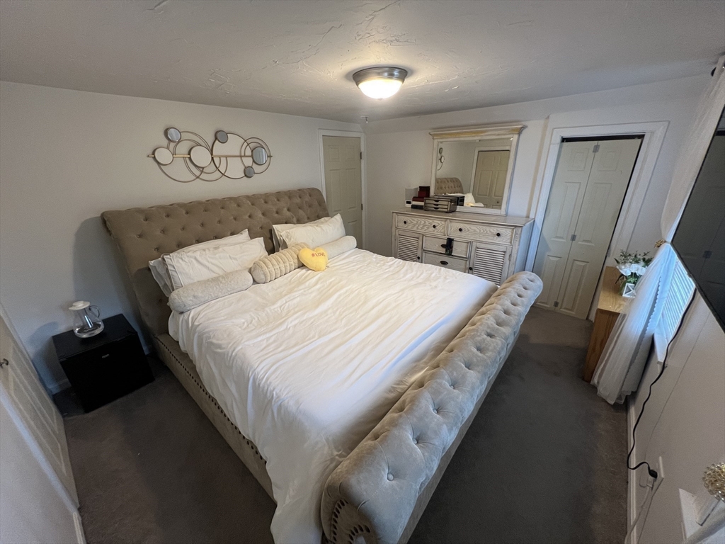 40 Chestnut Street Milford, MA 01757 - Photo 13 of 19 a bedroom with a bed and a walk in closet