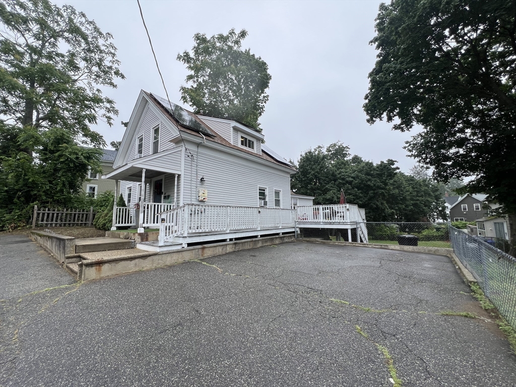 40 Chestnut Street Milford, MA 01757 - Photo 18 of 19 a view of patio with a table and chairs under an umbrella