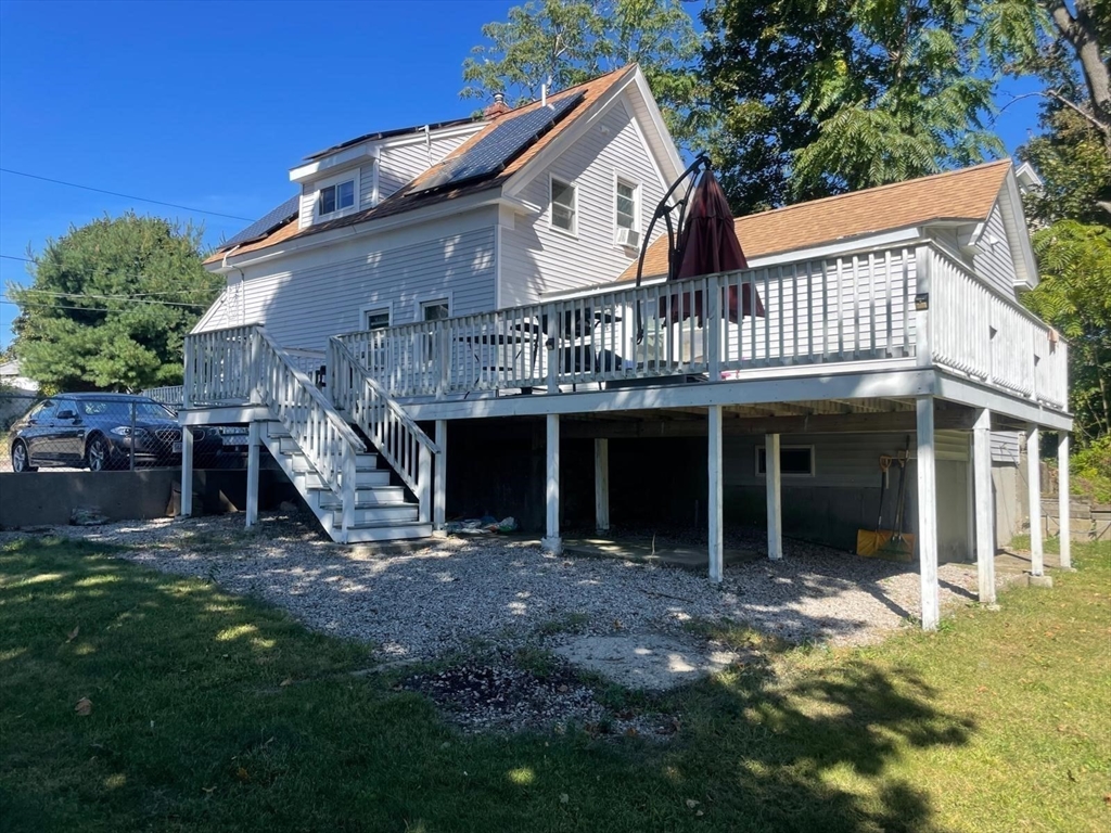 40 Chestnut Street Milford, MA 01757 - Photo 3 of 19 a front view of a house with a yard