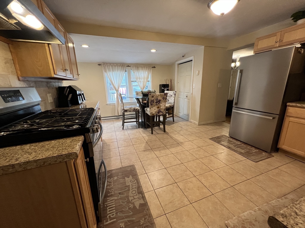 40 Chestnut Street Milford, MA 01757 - Photo 8 of 19 a kitchen with stainless steel appliances a refrigerator sink and cabinets