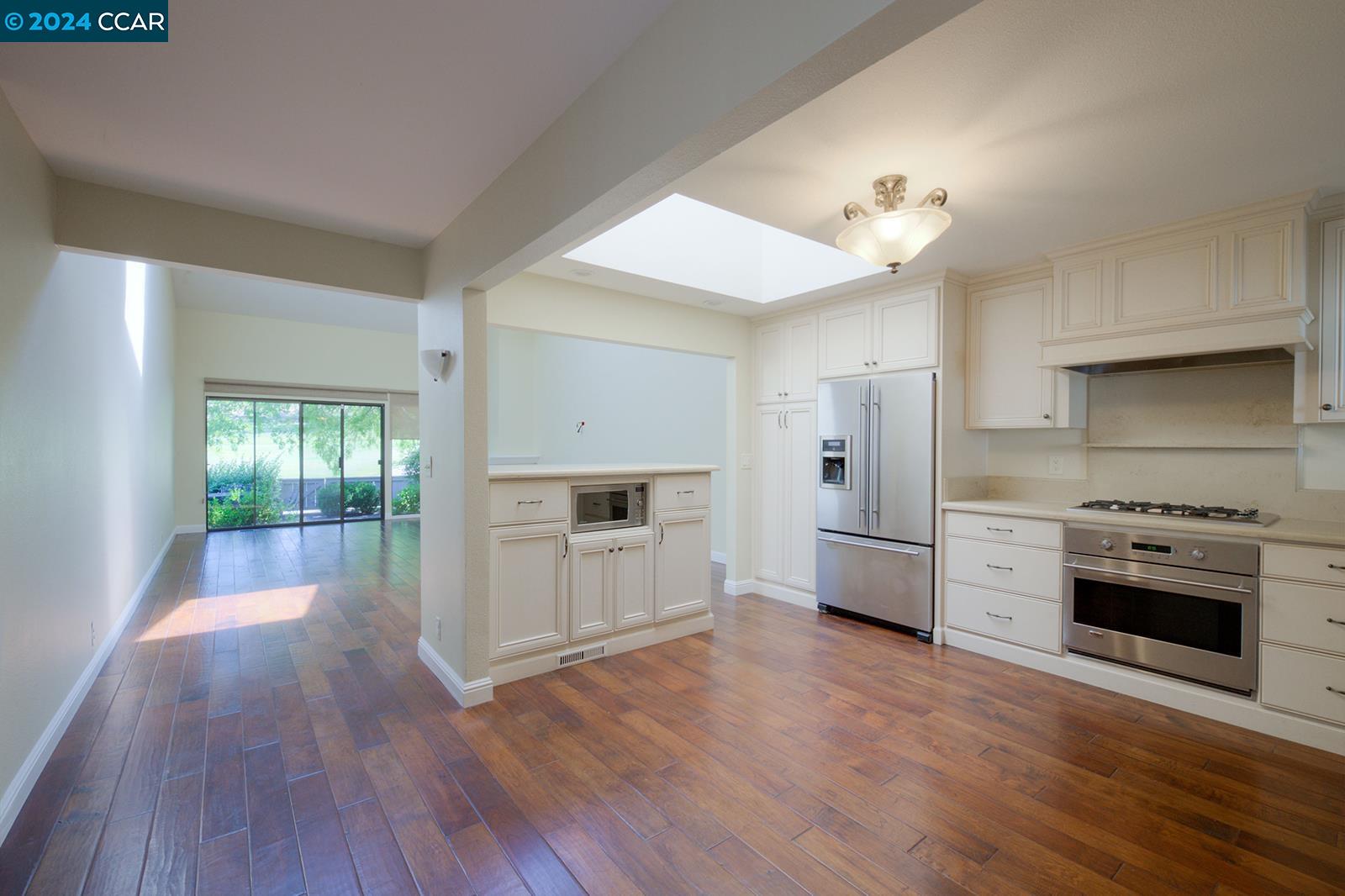 564 Cambrian Way Danville, CA 94526 - Photo 3 of 13 a kitchen with stainless steel appliances a stove a sink and a refrigerator