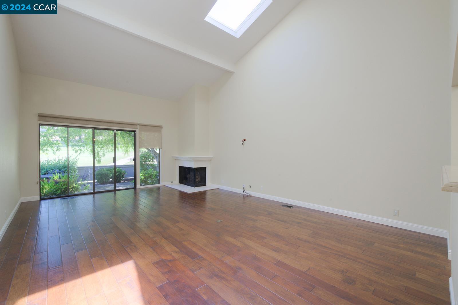 564 Cambrian Way Danville, CA 94526 - Photo 4 of 13 a view of empty room with wooden floor and fan