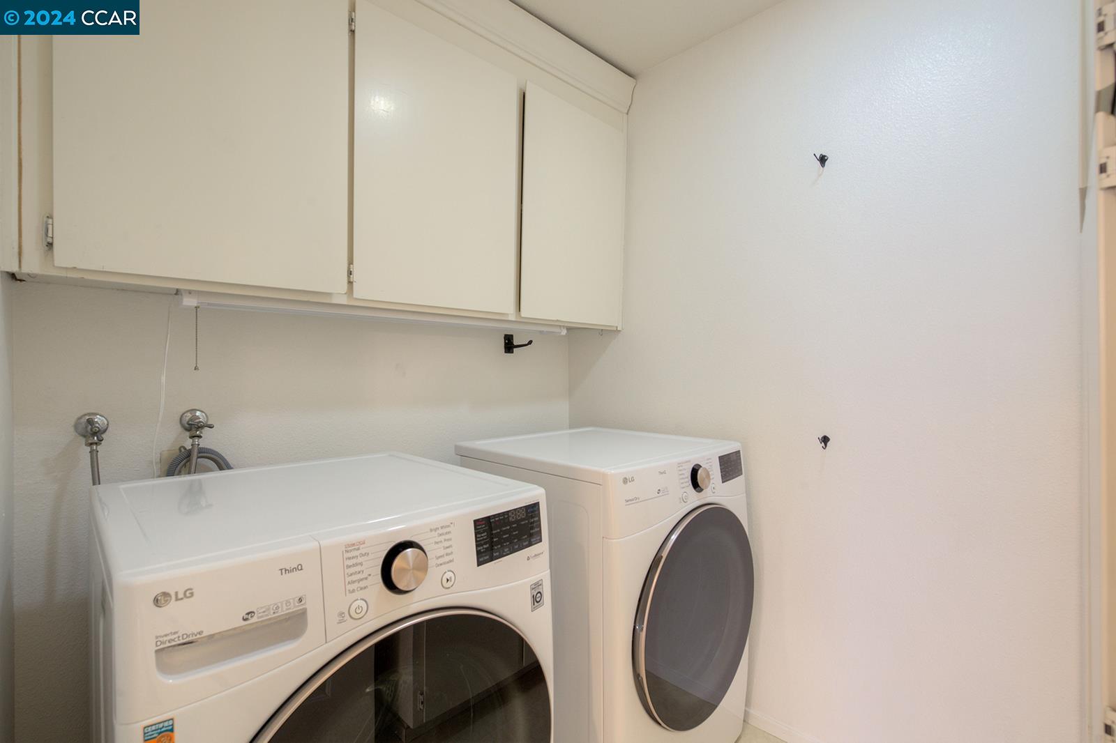 564 Cambrian Way Danville, CA 94526 - Photo 8 of 13 a utility room with dryer and washer