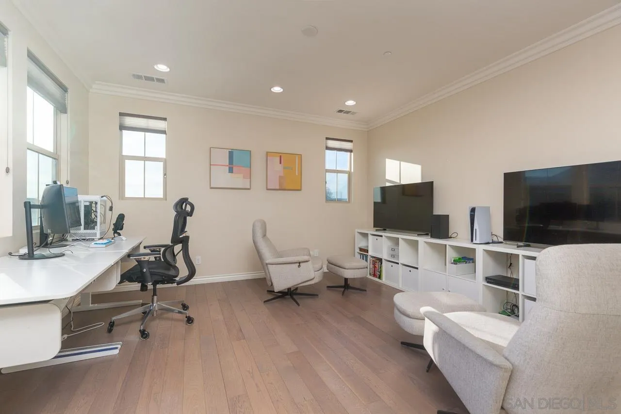 15622 Potomac Ridge Road San Diego, CA 92127 - Photo 17 of 49 a living room with furniture and a flat screen tv