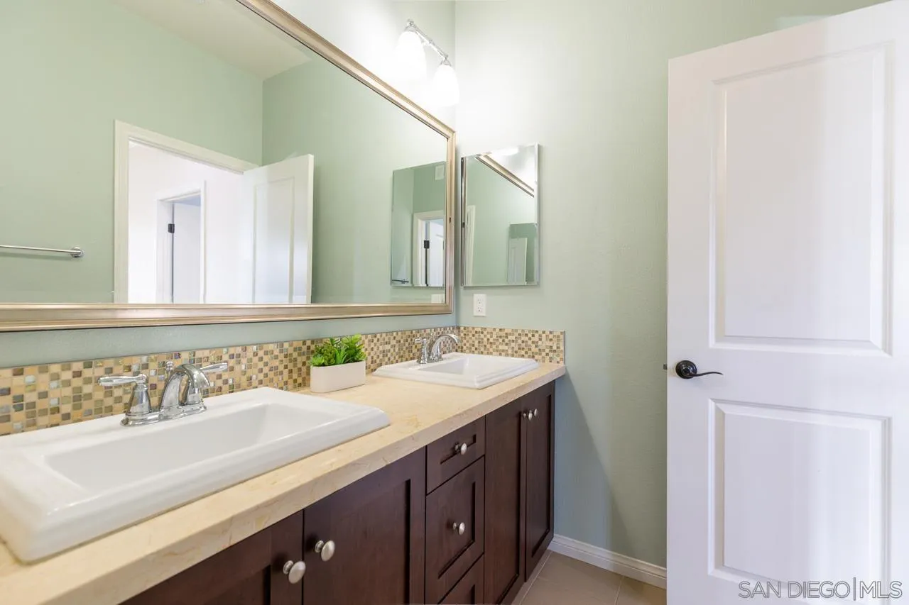 15622 Potomac Ridge Road San Diego, CA 92127 - Photo 18 of 49 a bathroom with a sink and a mirror
