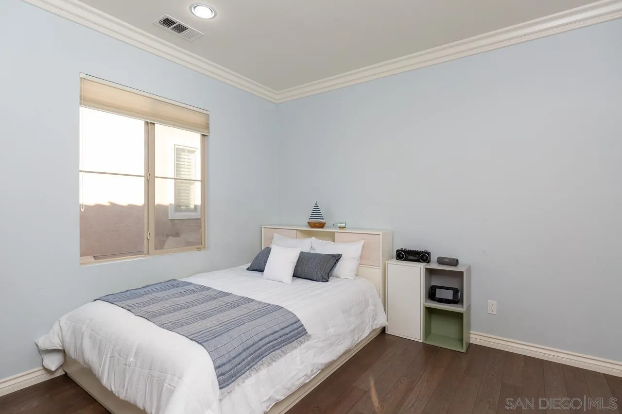 15622 Potomac Ridge Road San Diego, CA 92127 - Photo 23 of 49 a bedroom with a large bed and a window