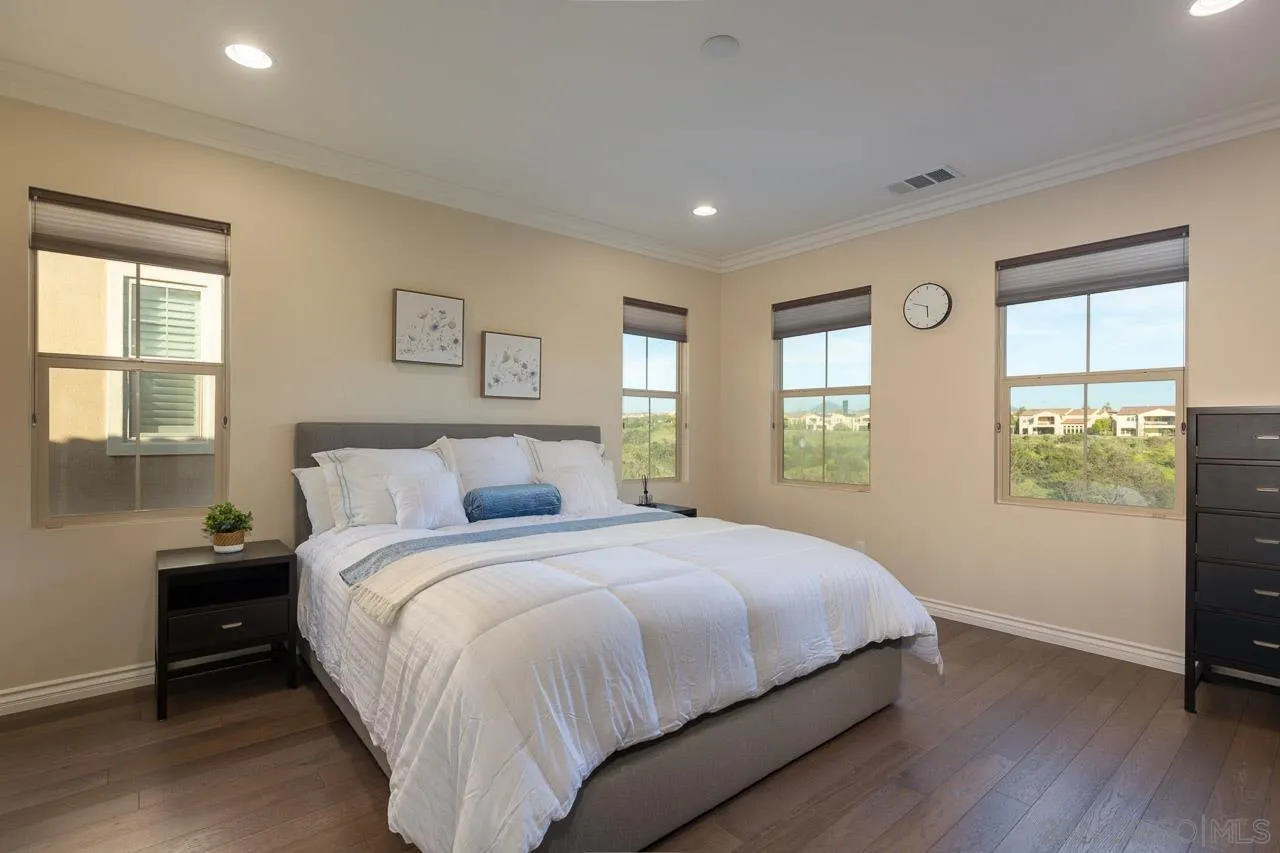 15622 Potomac Ridge Road San Diego, CA 92127 - Photo 30 of 49 a bedroom with a large bed and a window