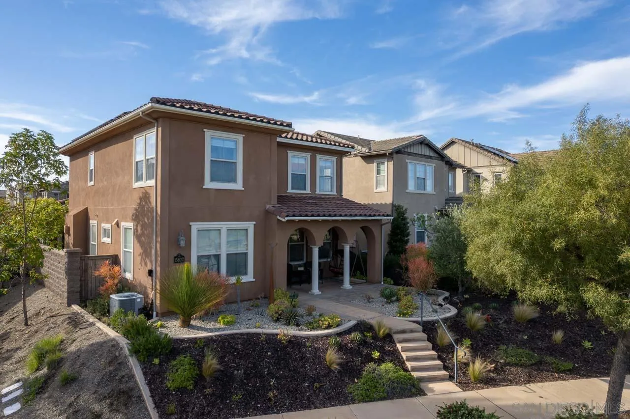 15622 Potomac Ridge Road San Diego, CA 92127 - Photo 3 of 49 a front view of a house with a garden