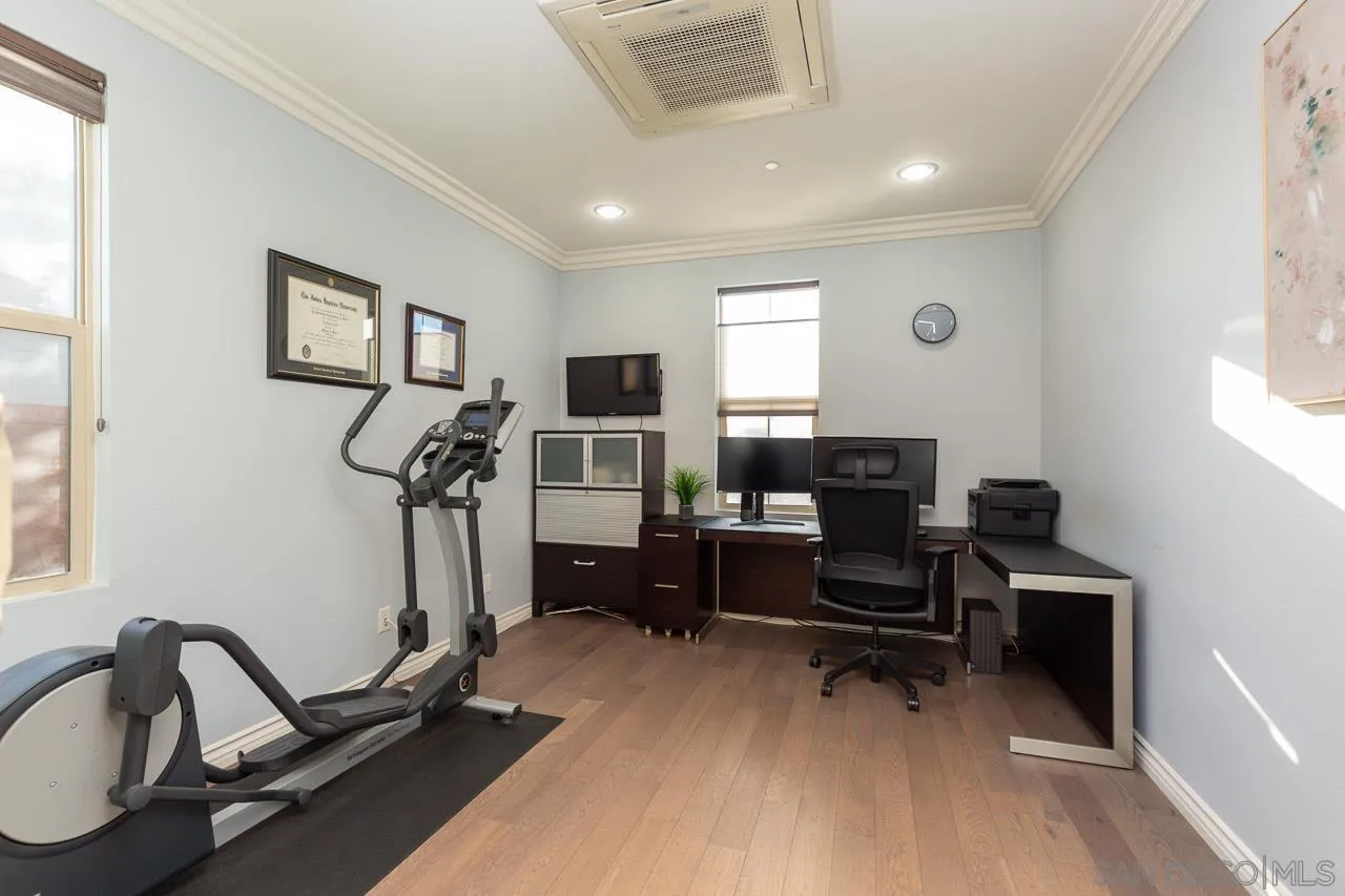 15622 Potomac Ridge Road San Diego, CA 92127 - Photo 31 of 49 a view of a workspace with furniture and a window