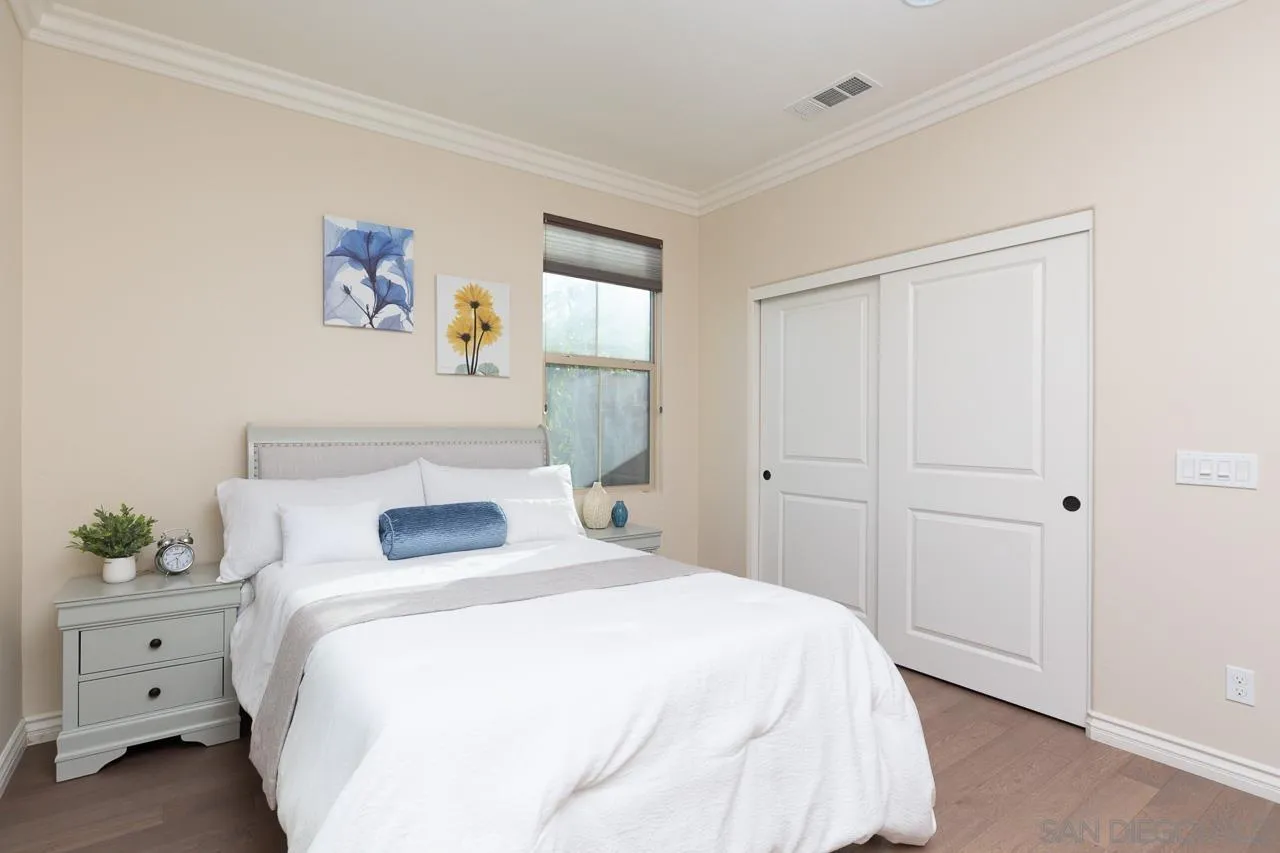 15622 Potomac Ridge Road San Diego, CA 92127 - Photo 33 of 49 a bedroom with a bed and painting on the wall