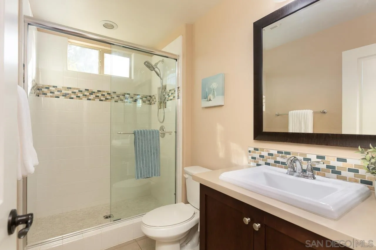 15622 Potomac Ridge Road San Diego, CA 92127 - Photo 35 of 49 a bathroom with a sink a toilet and shower