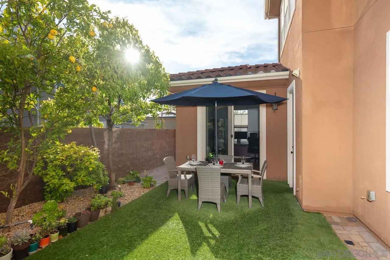 15622 Potomac Ridge Road San Diego, CA 92127 - Photo 36 of 49 a view of a chair and table in backyard of the house