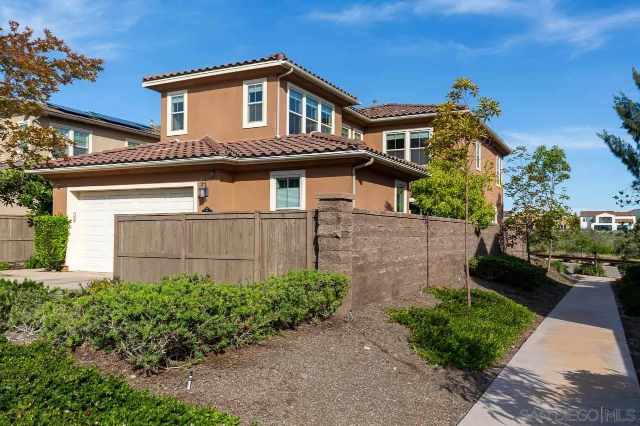15622 Potomac Ridge Road San Diego, CA 92127 - Photo 5 of 49 a front view of a house with a garden