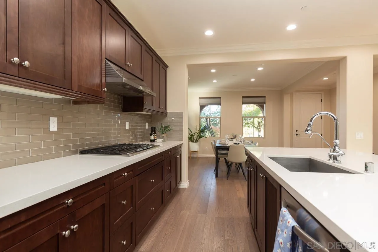 15622 Potomac Ridge Road San Diego, CA 92127 - Photo 9 of 49 a kitchen with a sink stove and cabinets