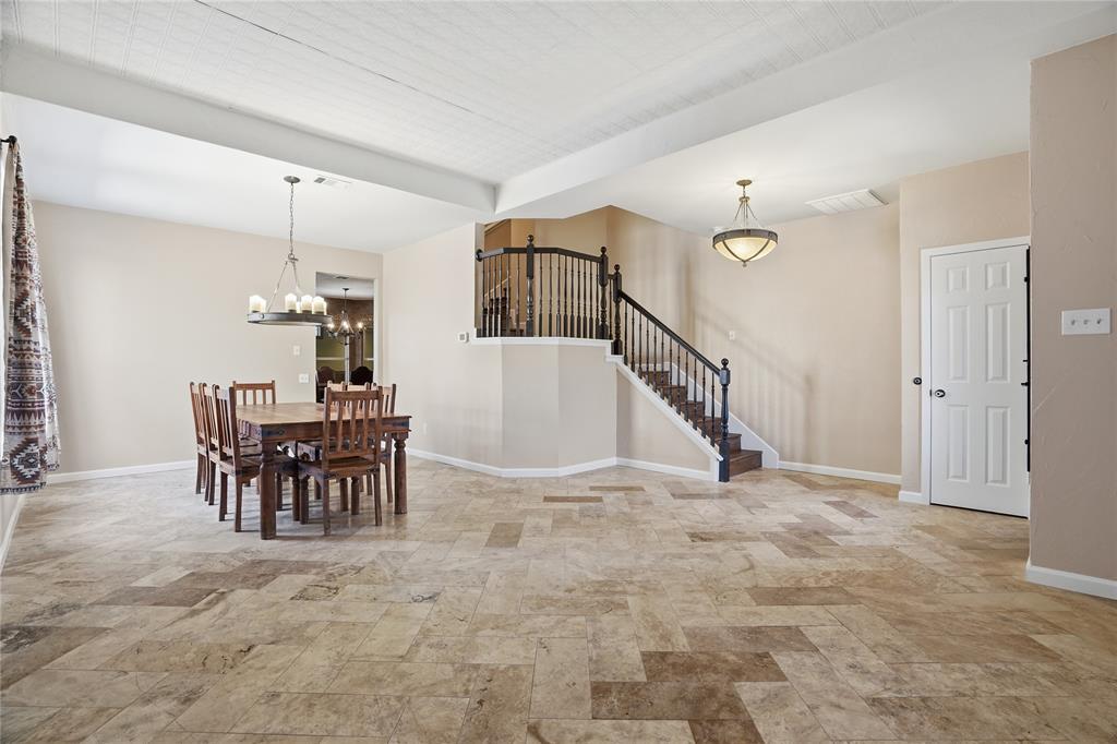 2133 Rustic Ridge Drive Keller, TX 76248 - Photo 5 of 40 Dining room featuring stairs and a chandelier